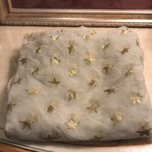 Lovely piece of sheer fabric with gold leaf style stars.